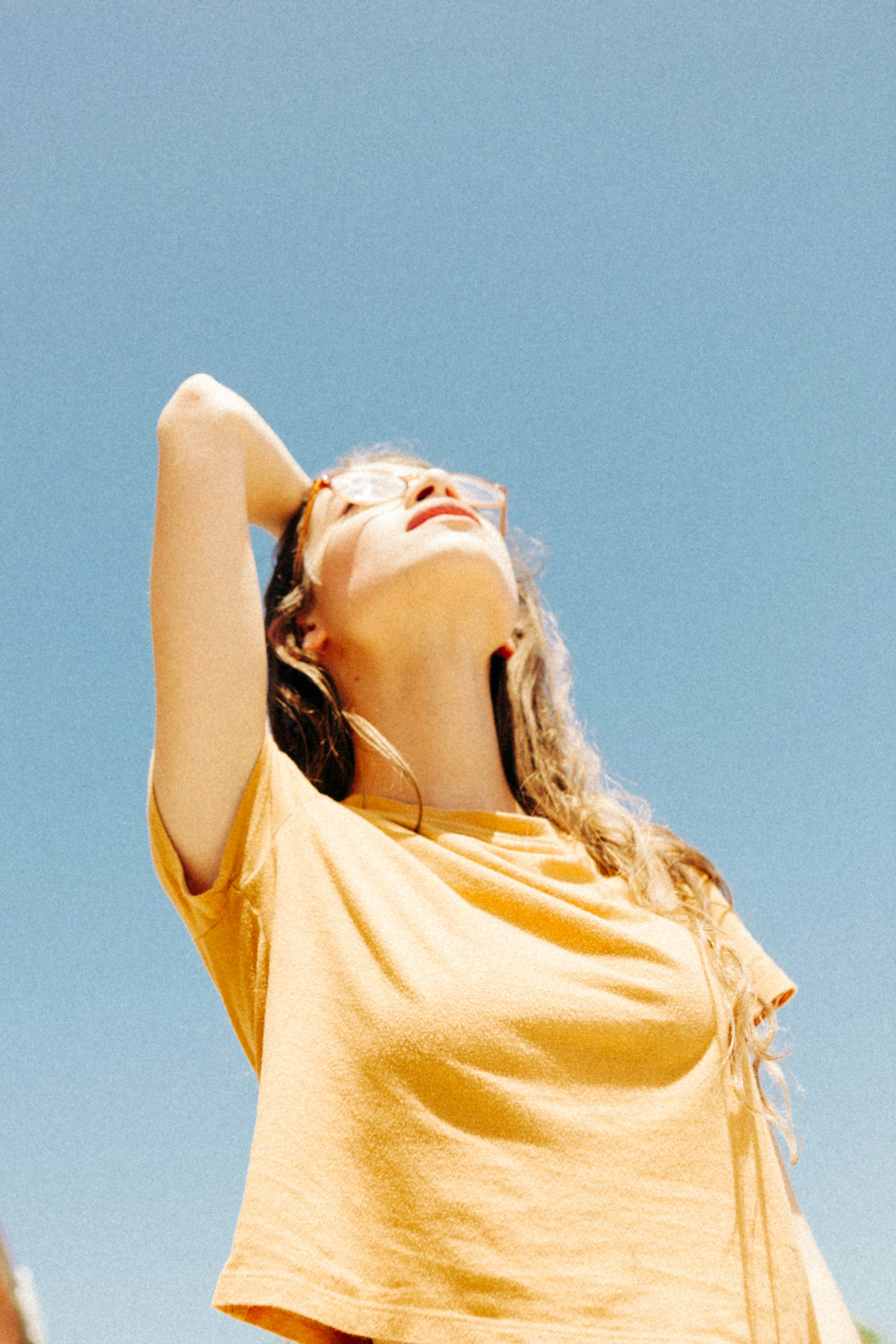 woman wearing yellow top during daytime